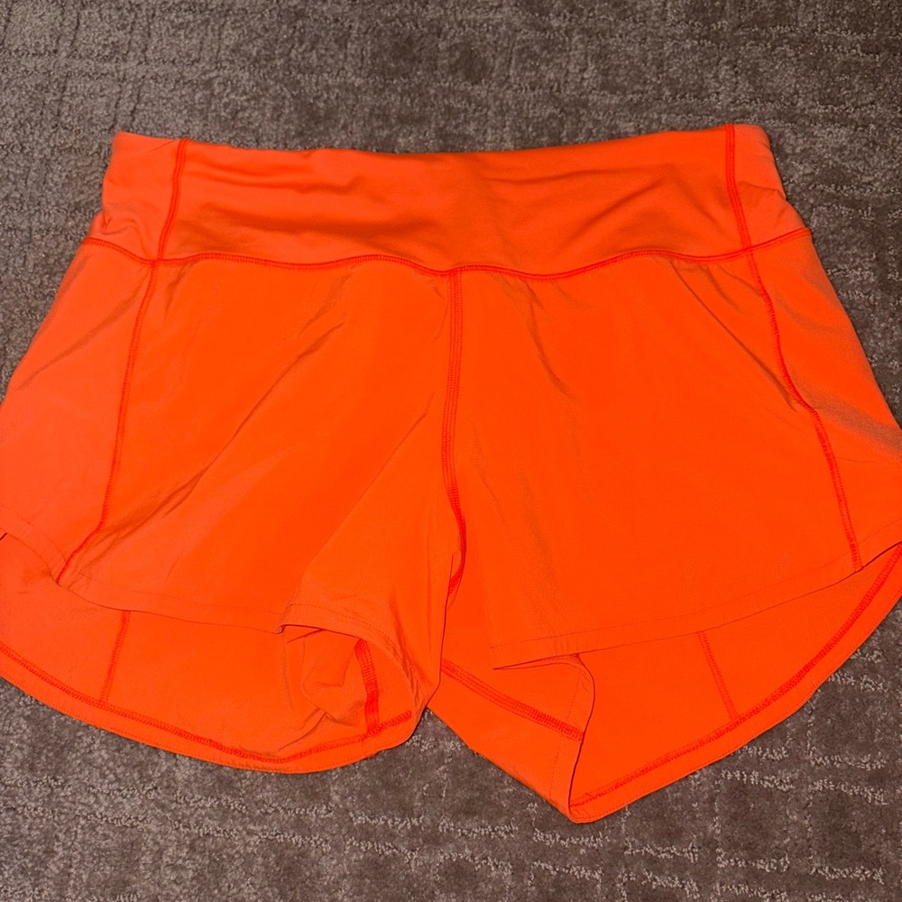 Womens lululemon 4in speed up shorts in size 6 orange